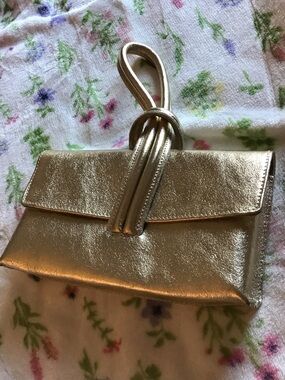 Metallic leather Gold Knot Clutch style hand bag